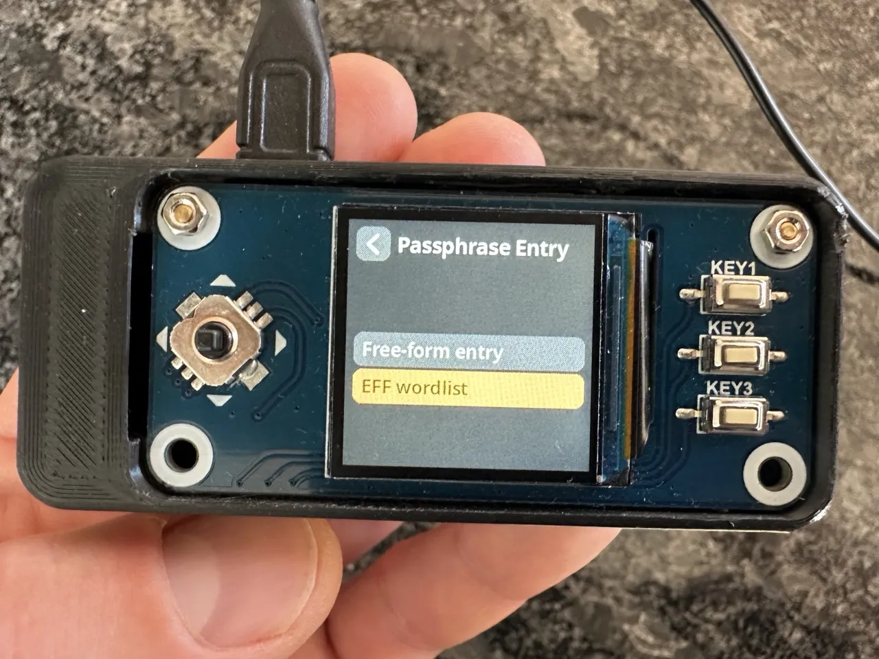 SeedSigner passphrase entry menu showing free-form entry and EFF wordlist options